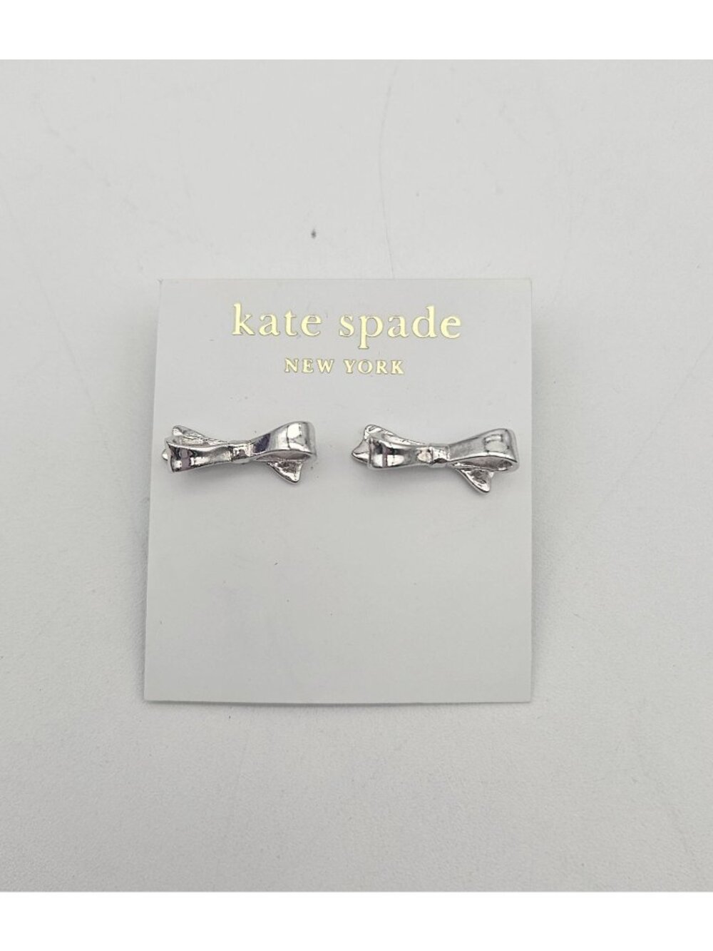 Kate Spade Silver Tone Skinny Mini Bow Earrings On Hang Card
